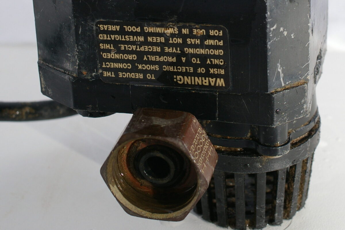 Discharge outlet and intake on an older AC primary sump pump